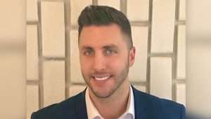 Ash Gordon, 33, was stabbed and hit by a car after he took on the group who allegedly robbed his unit. (Nine)
